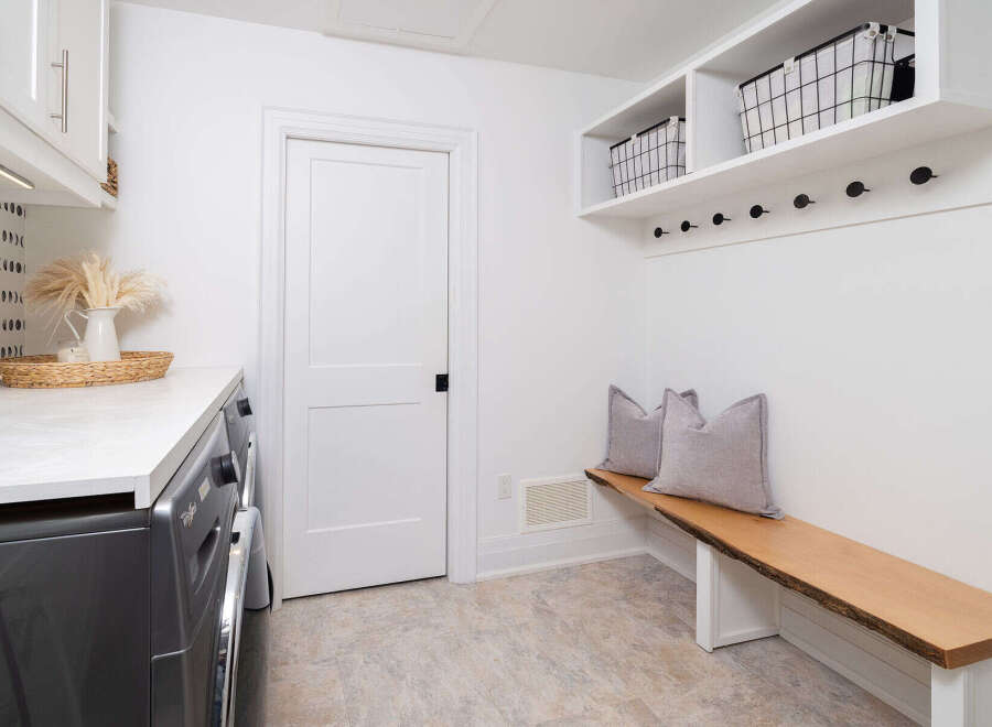 This stunning laundry room boasts a modern design with a touch of rustic charm.