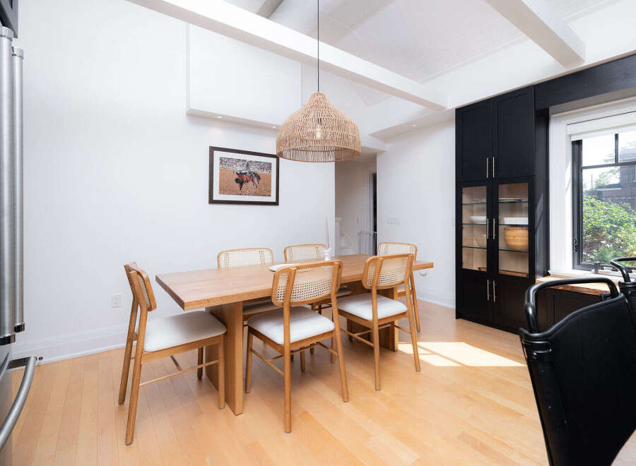 This stunning dining room features a modern design with a touch of rustic charm.