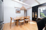 This stunning dining room features a modern design with a touch of rustic charm.