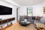 Step into modern elegance with this stunning living space.