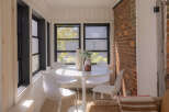 Enjoy the charm of this sun-drenched sunroom, perfect for morning coffee or evening relaxation.