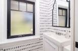This stylish bathroom features a unique moon phase wallpaper, creating a serene and artistic atmosphere.