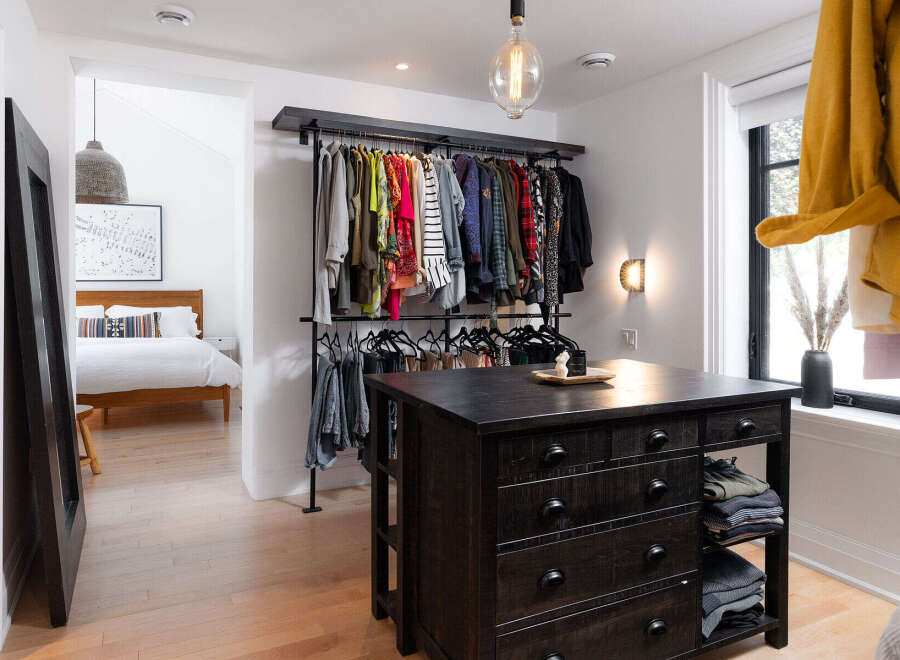 Step into luxury with this stunning walk-in closet, a perfect blend of style and functionality.