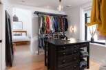 Step into luxury with this stunning walk-in closet, a perfect blend of style and functionality.