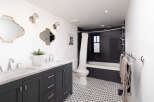 This stunning bathroom boasts a modern design with a touch of elegance.