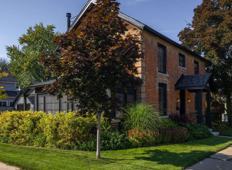 This stunning brick home offers timeless charm and modern comfort.