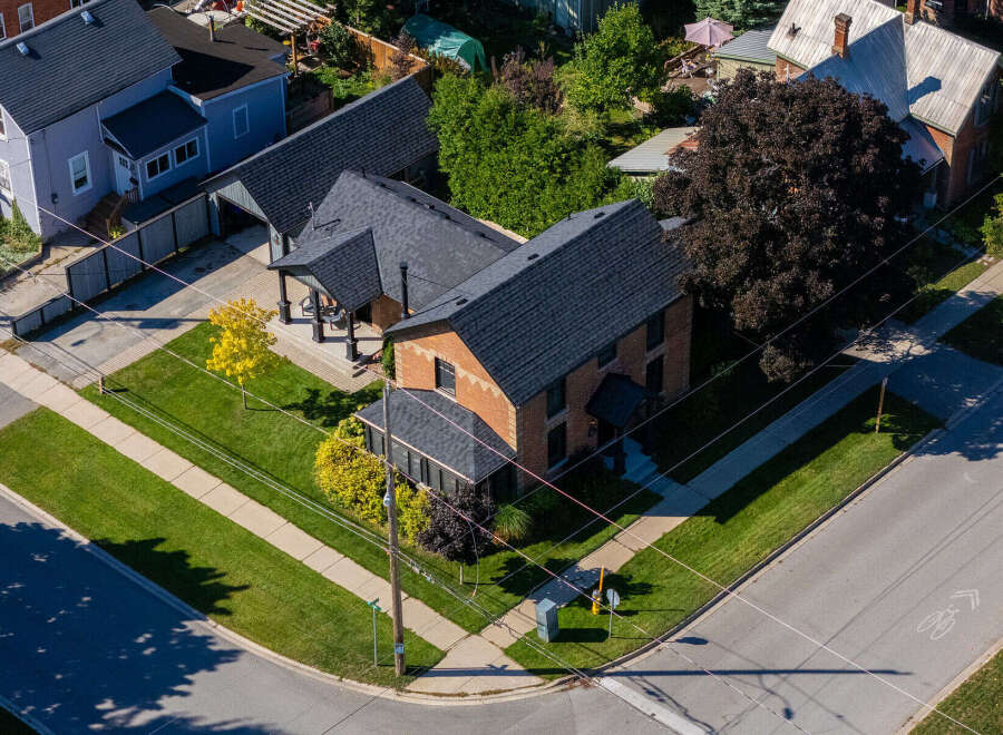 This stunning brick home boasts a charming exterior and a well-manicured lawn, perfect for curb appeal.