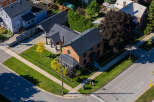 This stunning brick home boasts a charming exterior and a well-manicured lawn, perfect for curb appeal.