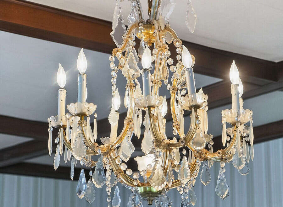 Elegant chandelier illuminates a room, adding a touch of luxury and sophistication.