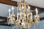 Elegant chandelier illuminates a room, adding a touch of luxury and sophistication.