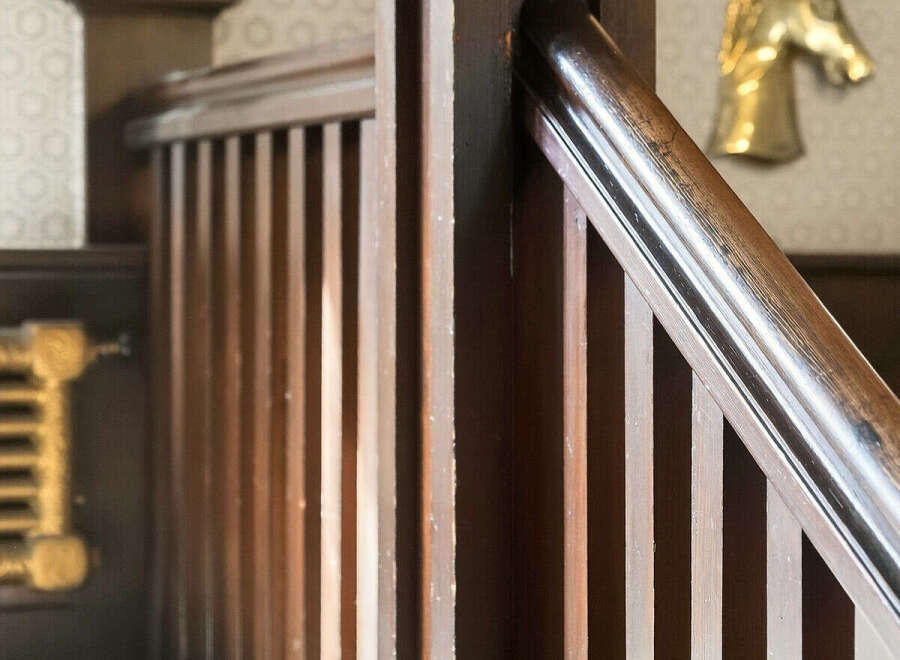 This stunning property boasts a beautifully crafted wooden staircase, adding a touch of elegance and warmth to the interior.