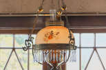 This stunning property features a beautiful antique chandelier, adding a touch of elegance and charm to the space.