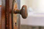 A close-up shot showcases a vintage door with a classic brass doorknob, adding a touch of elegance to any home.