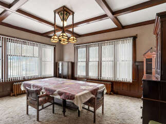 Step into a beautifully preserved dining room, showcasing timeless elegance.