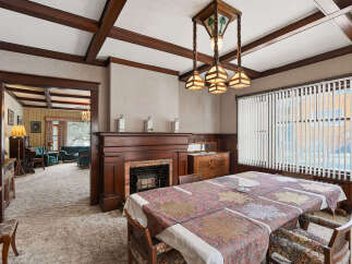 Step back in time with this stunning dining room, showcasing exquisite craftsmanship and timeless elegance.