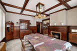 Step into a beautifully preserved dining room, showcasing exquisite craftsmanship and timeless elegance.