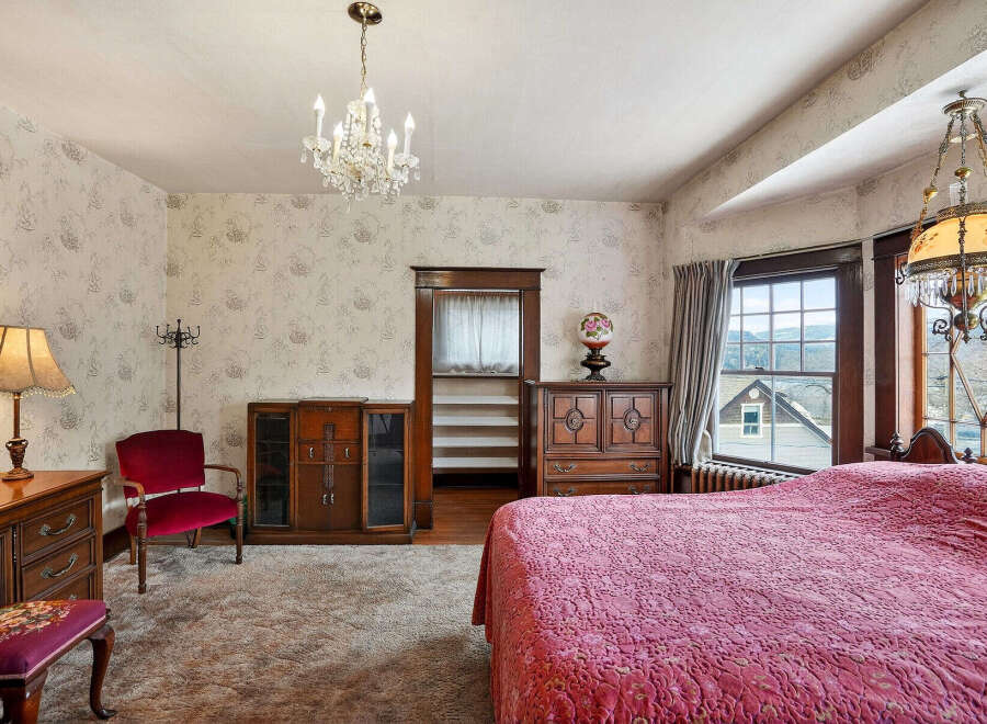 Step into a charming bedroom with vintage appeal.