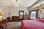Step into a charming bedroom with vintage appeal.