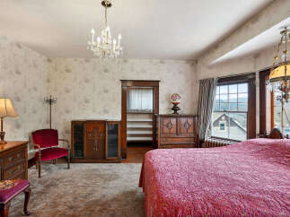 Step into a charming bedroom with vintage appeal.