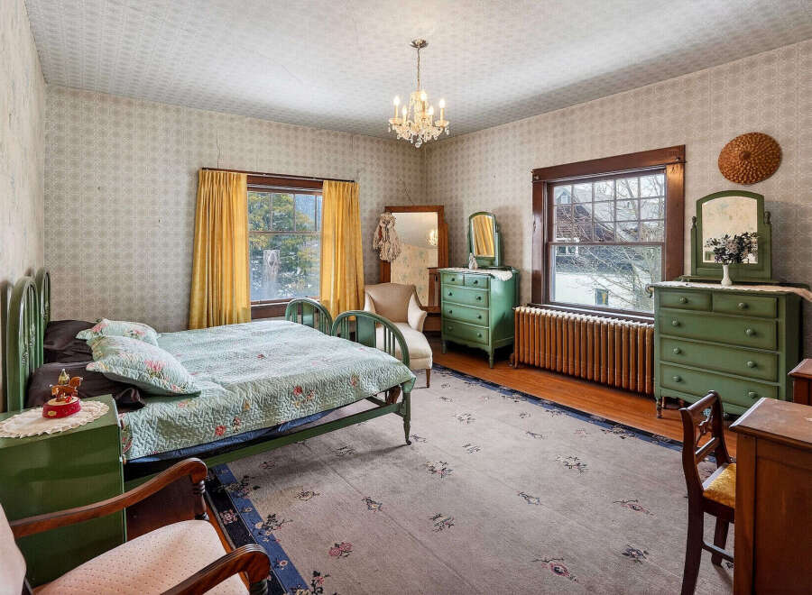 Step into a charming bedroom with vintage appeal.