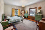 Step into a charming bedroom with vintage appeal.