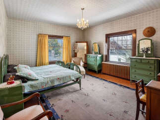 Step into a charming bedroom with vintage appeal.
