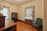 Step back in time with this charming room featuring original hardwood floors and classic details.