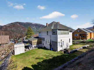 This charming two-story home offers a blend of classic design and modern comfort.