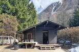 Nestled in a picturesque mountain setting, this charming cabin offers a serene escape.