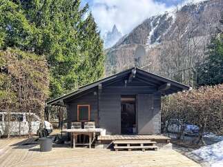 Nestled in a picturesque mountain setting, this charming cabin offers a serene escape.