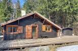 Discover the charm of this cozy cabin nestled in a serene, wooded setting.