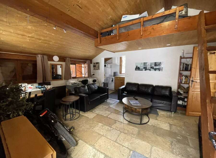 Discover this charming property featuring a cozy living space with a loft area, perfect for relaxation or entertaining.
