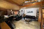 Discover this charming property featuring a cozy living space with a loft area, perfect for relaxation or entertaining.
