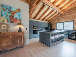 Discover the epitome of modern living in this stunning property, featuring a beautifully designed kitchen with sleek cabinetry and a spacious island.