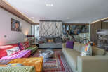 Step into luxury with this stunning living room, featuring a cozy fireplace and stylish decor.