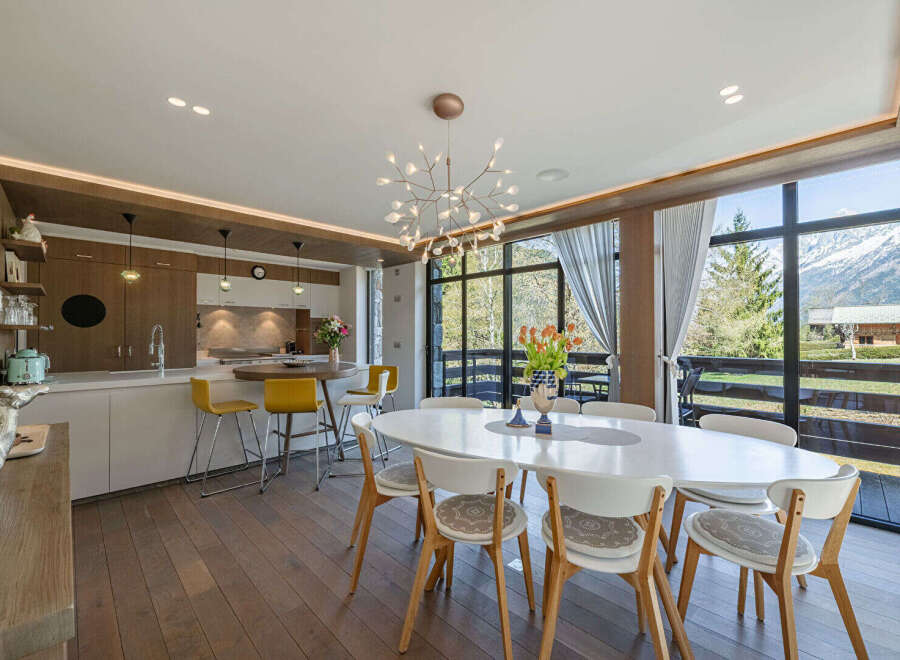 Experience luxury living in this stunning property, featuring a modern kitchen with sleek countertops and a stylish breakfast bar.