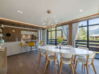 Experience luxury living in this stunning property, featuring a modern kitchen with sleek countertops and a stylish breakfast bar.