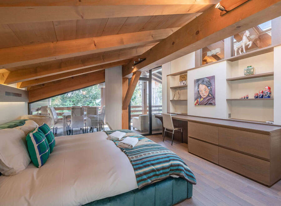 Experience luxury living in this stunning bedroom with a unique architectural design.