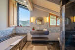 Step into luxury with this stunning bathroom, featuring a sleek, modern design.