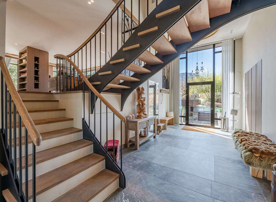 Step into luxury with this stunning property featuring a modern staircase design.