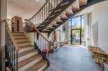 Step into luxury with this stunning property featuring a modern staircase design.