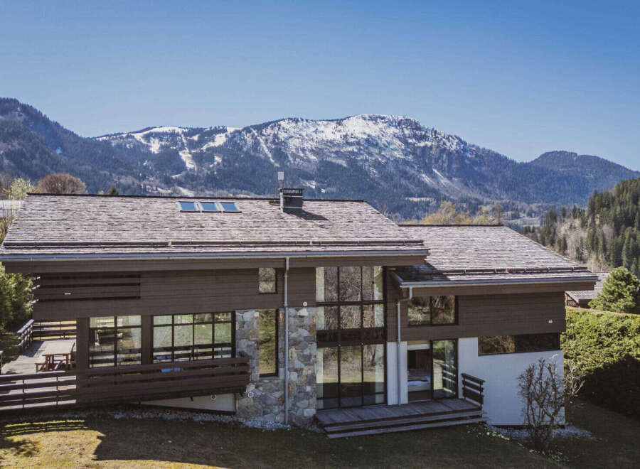 Discover the epitome of alpine luxury in this stunning property, boasting a modern design with expansive windows that frame breathtaking mountain views.