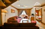 Discover the charm of this cozy property, featuring a warm and inviting living area with comfortable seating and a stylish design.