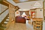 Discover the charm of this inviting property, featuring a cozy living space with a comfortable sofa and a dining area perfect for gatherings.