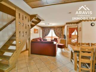 Discover the charm of this inviting property, featuring a cozy living space with a comfortable sofa and a dining area perfect for gatherings.
