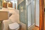 Discover this charming bathroom featuring a modern shower and stylish tile work.