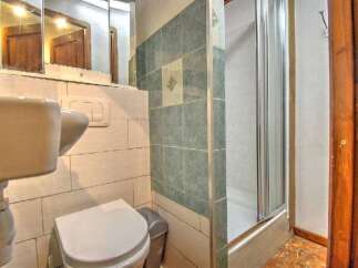 Discover this charming bathroom featuring a modern shower and stylish tile work.