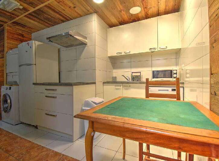 This charming kitchen offers a cozy and functional space, perfect for preparing meals and enjoying quality time.