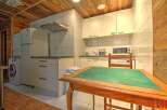 This charming kitchen offers a cozy and functional space, perfect for preparing meals and enjoying quality time.