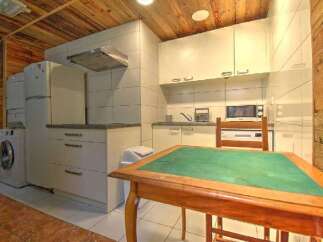 This charming kitchen offers a cozy and functional space, perfect for preparing meals and enjoying quality time.